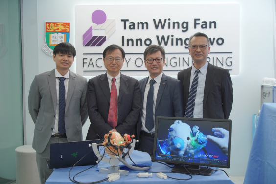  (From left) Dr Zhuoliang He, Professor Wai-Sang Poon, Professor Ka-Wai Kwok, Dr Danny Tat Ming Chan and the MRI-guided multi-stage robotic positioner.  